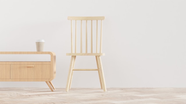 دکوراسیون مدرن مینیمال و ساده، تصویر یک فضای ساده با یک صندلی و یک میز چوبی را نمایش می دهد